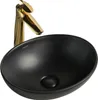 A black ceramic washbasin with a gold faucet against a white background. Produktbild-Vorschau