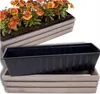 A planter box with flowers and a separate plastic insert. Podgląd zdjęcia produktu