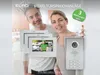 A couple is shown with a video door intercom system. Produktbild-Vorschau