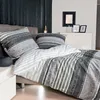 A bedroom scene with bedding and decorative items. Produktbild-Vorschau