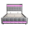 A grey upholstered bed frame with pink LED lighting. Produktbild-Vorschau