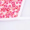 A close-up view of a fabric with a floral pattern, bordered by white trim. Produktbild-Vorschau