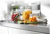 Three glass jars filled with food items are displayed on a kitchen counter. Produktbild-Vorschau