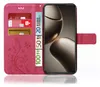 A pink phone case with a floral pattern, showing credit cards and euro banknotes inserted into its compartments, and a smartphone placed inside. Produktbild-Vorschau