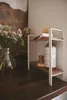 A kitchen shelf with cleaning supplies and flowers. Anteprima dell’immagine prodotto