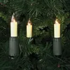 Three candle-shaped Christmas lights are attached to a green artificial Christmas tree. Produktbild-Vorschau