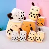 A collection of bubble tea plush toys arranged on a surface with a colored background. Produktbild-Vorschau