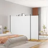 A bedroom scene with a white room divider separating the bed area from the rest of the room. Anteprima dell’immagine prodotto