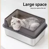 A cat is lying in a large, open litter box with high sides. Náhľad obrázku produktu