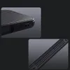 Close-up shots of a black phone case, highlighting its textured surface and cutouts for ports. Náhled obrázku produktu