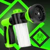 A green and black foam cannon sprayer with a clear reservoir, set against a dark background with bright green geometric lines and a diamond-shaped icon of a water gun with a drip. Podgląd zdjęcia produktu
