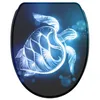 A toilet seat with a glowing turtle design. Produktbild-Vorschau