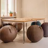 A meeting room with a table and several large, round seating balls. Produktbild-Vorschau