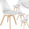 A set of four white dining chairs with wooden legs, arranged on a white background. Náhled obrázku produktu