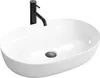 A white oval countertop sink with a black faucet. Anteprima dell’immagine prodotto
