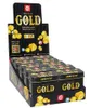 A display box filled with multiple small metal tins of the board game 'Gold'. Anteprima dell’immagine prodotto