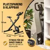 A stationary bike is shown in two states: unfolded and folded, with text highlighting its space-saving and foldable features, along with dimensions and suitability for different body heights. Produktbild-Vorschau