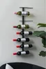 A wall-mounted wine rack holding several bottles of wine. Náhled obrázku produktu