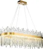 A rectangular chandelier with numerous clear crystal-like rods hanging from a gold-colored frame. Náhľad obrázku produktu