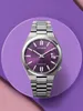 A close-up shot of a Citizen watch with a purple dial, presented on a purple circular platform against a pink and purple background. Produktbild-Vorschau