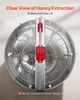A top-down view of a honey extractor with a clear lid, showing the internal frame and a red locking mechanism. Anteprima dell’immagine prodotto