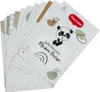 A fan of cards with illustrations of a panda, rainbow, and abstract shapes, with the brand name 'Tiny Love' visible. Produktbild-Vorschau