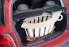 A wooden climbing arch is placed in the trunk of a red car. Produktbild-Vorschau