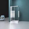 A modern shower enclosure with a sliding door, set against a teal wall and a light gray floor. A blue armchair with a brown cushion is visible in the background. Produktbild-Vorschau