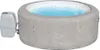 An inflatable hot tub filled with water, with a control unit attached to the side. Produktbild-Vorschau