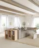 A living room with a sectional sofa, coffee table, and a cube shelf. Produktbild-Vorschau