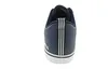 The back view of a dark blue Adidas sneaker with white stripes on the heel. Náhľad obrázku produktu