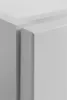 A close-up view of the corner of a white cabinet or furniture piece, showing the joinery and edges. Voir les images du produit