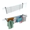 Two views of a foldable drying rack mounted on a railing, with the bottom view showing clothes hanging on it. Produktbild-Vorschau