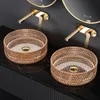 Two rose gold glass washbasins with faucets and mirrors in a modern bathroom setting. Anteprima dell’immagine prodotto