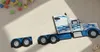 Modellauto-Regal für 160 Autos 1:64 – 2 Wandregale als Setzkasten für Spielzeugautos, US-Truck-Motiv, Weiß, Birken-Sperrholz – leere Fächer und Holzkonstruktion Produktbild-Vorschau