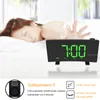 A person sleeping in bed with a projection alarm clock in the foreground. Produktbild-Vorschau