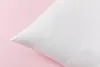 A white pillow is shown against a light pink background. Produktbild-Vorschau