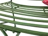 Close-up view of a green metal garden bench with a red and white patterned pillow visible at the top right. Náhľad obrázku produktu