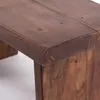 A close-up view of the corner of a wooden stool. Náhľad obrázku produktu