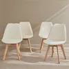 A set of four white, fluffy dining chairs with light wood legs arranged in a room. Produktbild-Vorschau