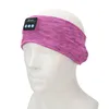 A pink and purple heathered headband with a small black control module on a white mannequin head. Náhled obrázku produktu