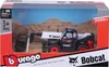 A toy Bobcat telehandler is displayed in its retail packaging, set against a backdrop of a desert landscape. Voir les images du produit