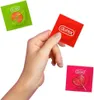 A hand holding a red Durex condom wrapper, with a green Durex condom wrapper and a pink Durex condom wrapper with a heart-shaped lollipop design in the background. Náhľad obrázku produktu
