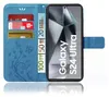 A blue flip case for a Samsung Galaxy S24 Ultra phone, with card slots and a stand function, is shown open. Produktbild-Vorschau