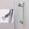 A close-up view of a shower door handle, with labels indicating inside and outside. Voir les images du produit
