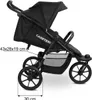 Side view of a black sport stroller on a white background with measurement indicators. Voir les images du produit