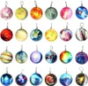 A collection of round, planet-like ornaments or charms arranged in a grid. Náhled obrázku produktu