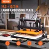 A VEVOR large embossing plate machine is shown in a workshop setting, with various tools and materials in the foreground and background. Anteprima dell’immagine prodotto