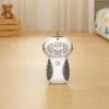 A remote-controlled robot toy is placed on a wooden floor in a room with a teddy bear and a crib in the background. Anteprima dell’immagine prodotto