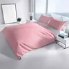 A neatly made bed with pink and gray striped bedding in a bright, modern room with large windows. Produktbild-Vorschau